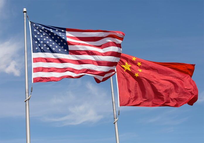 US-China-flags-GettyImages-515912196-1200 الصين تعاقب 12 شركة دفاع أمريكية بسبب تايوان (ديسمبر 2025)