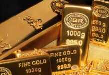 الذهب يتراجع مع توقعات ببقاء الفائدة مرتفعة