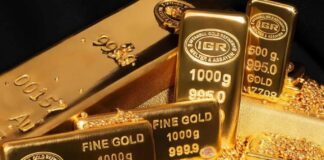الذهب يتراجع مع توقعات ببقاء الفائدة مرتفعة